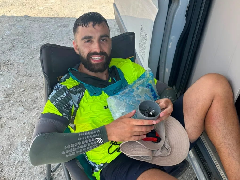 The athlete slumped in a camp chair holding an ice pack against his head